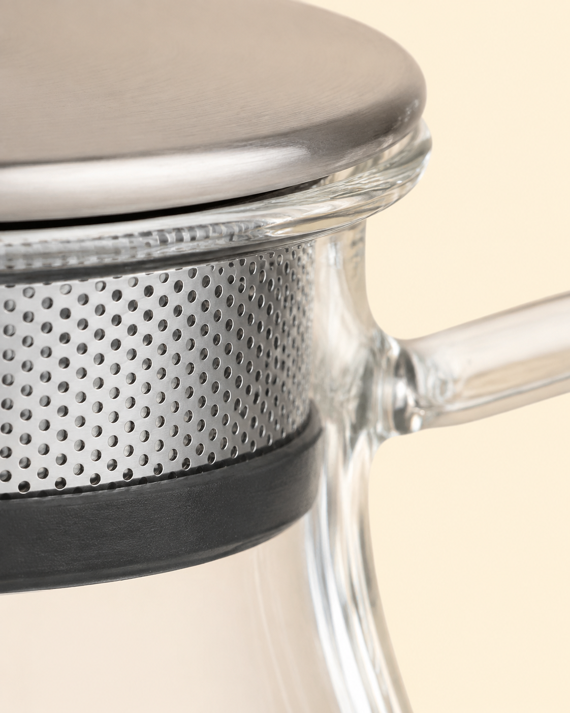 Ember Bloom glass teapot with loose tea leaves visible through the clear glass body