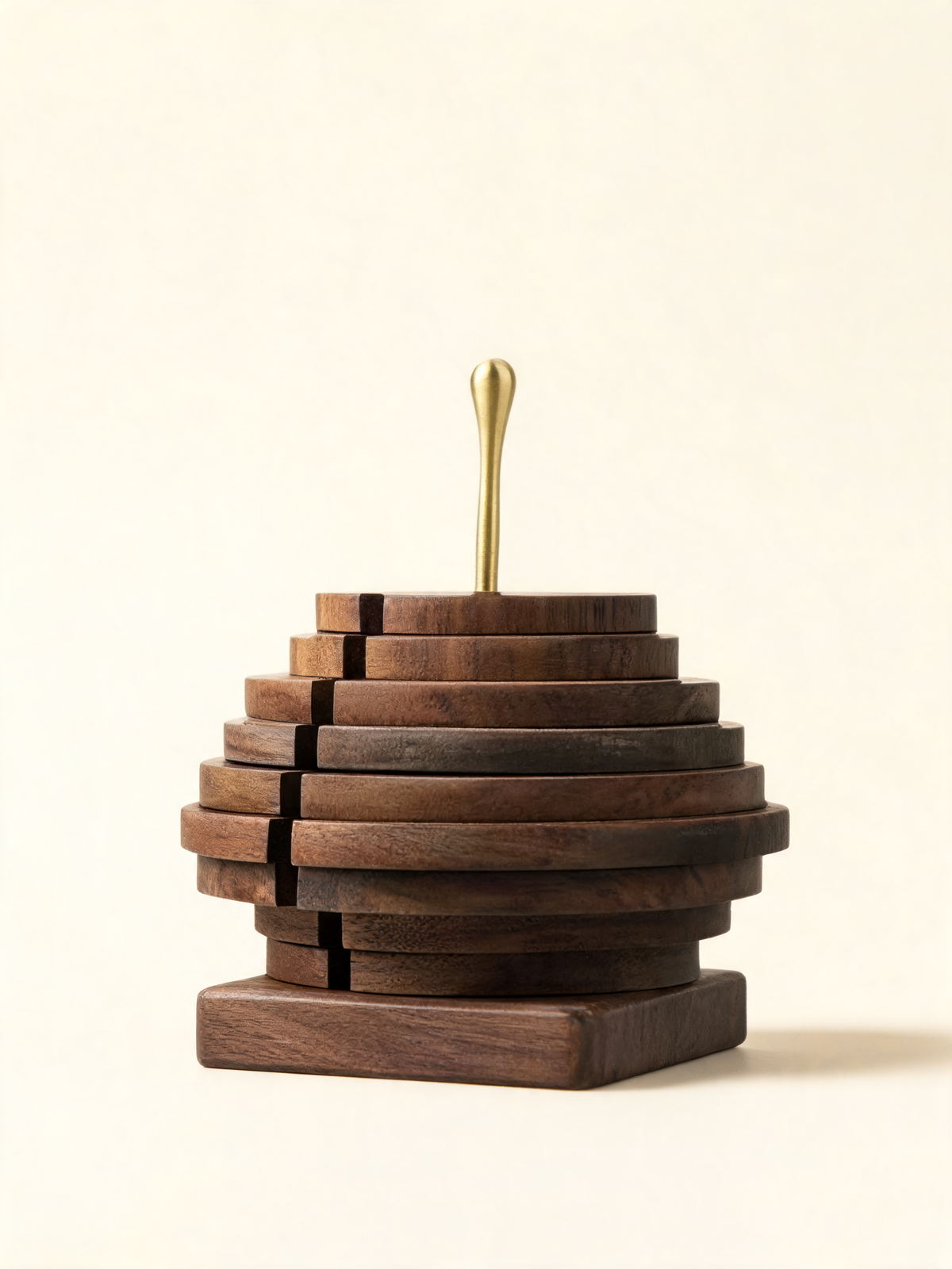 Black Walnut Spiral Coaster Set with rotating walnut discs and brass rod