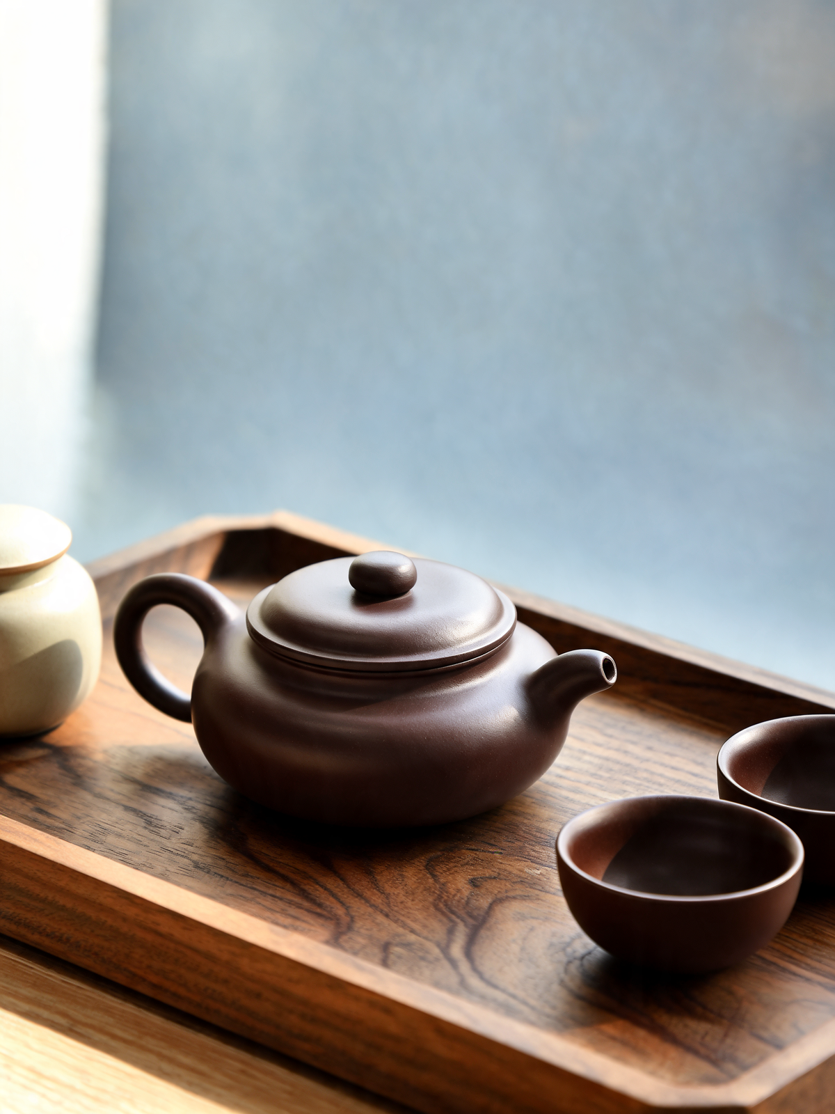 Hei Teapot with rounded body, tapered spout and sculpted ring handle