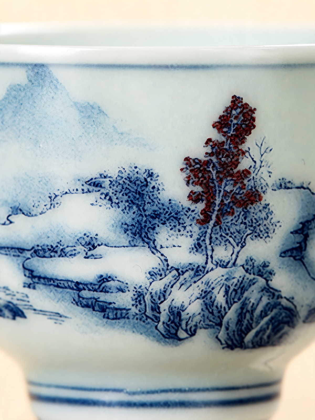 Detail of the painted mountains, water and pine tree decoration