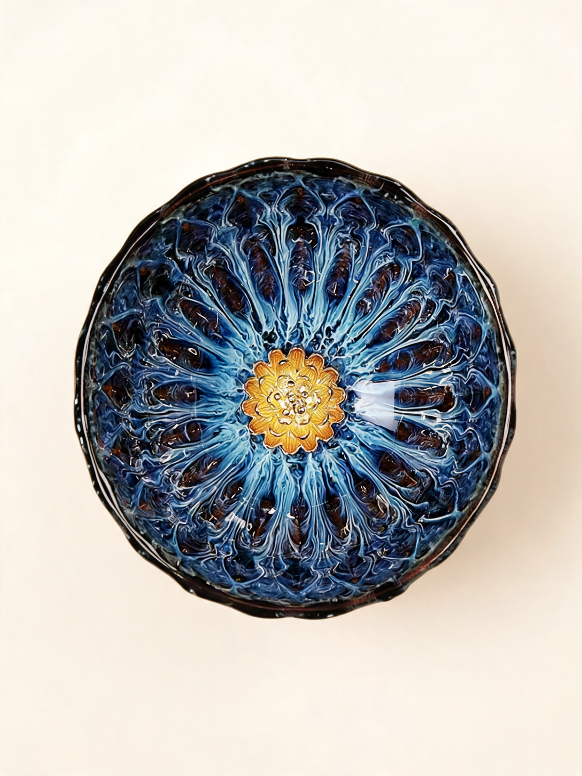 Detail of the golden floral medallion inside the Nebula Bloom Cup
