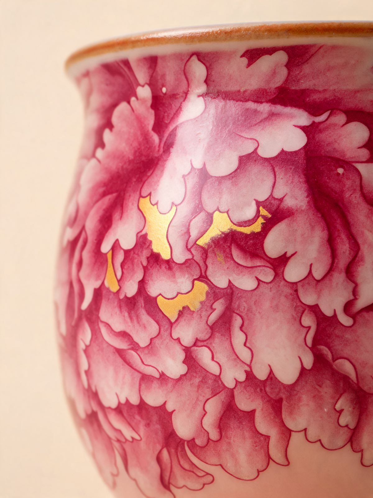Detail of the layered peony decoration and golden accents