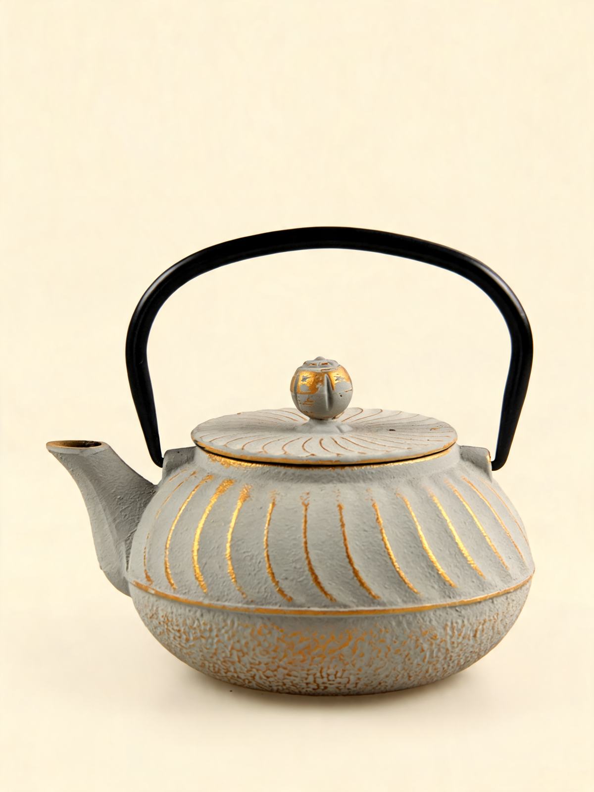 Uzu cream Japanese cast iron teapot with golden spiral pattern