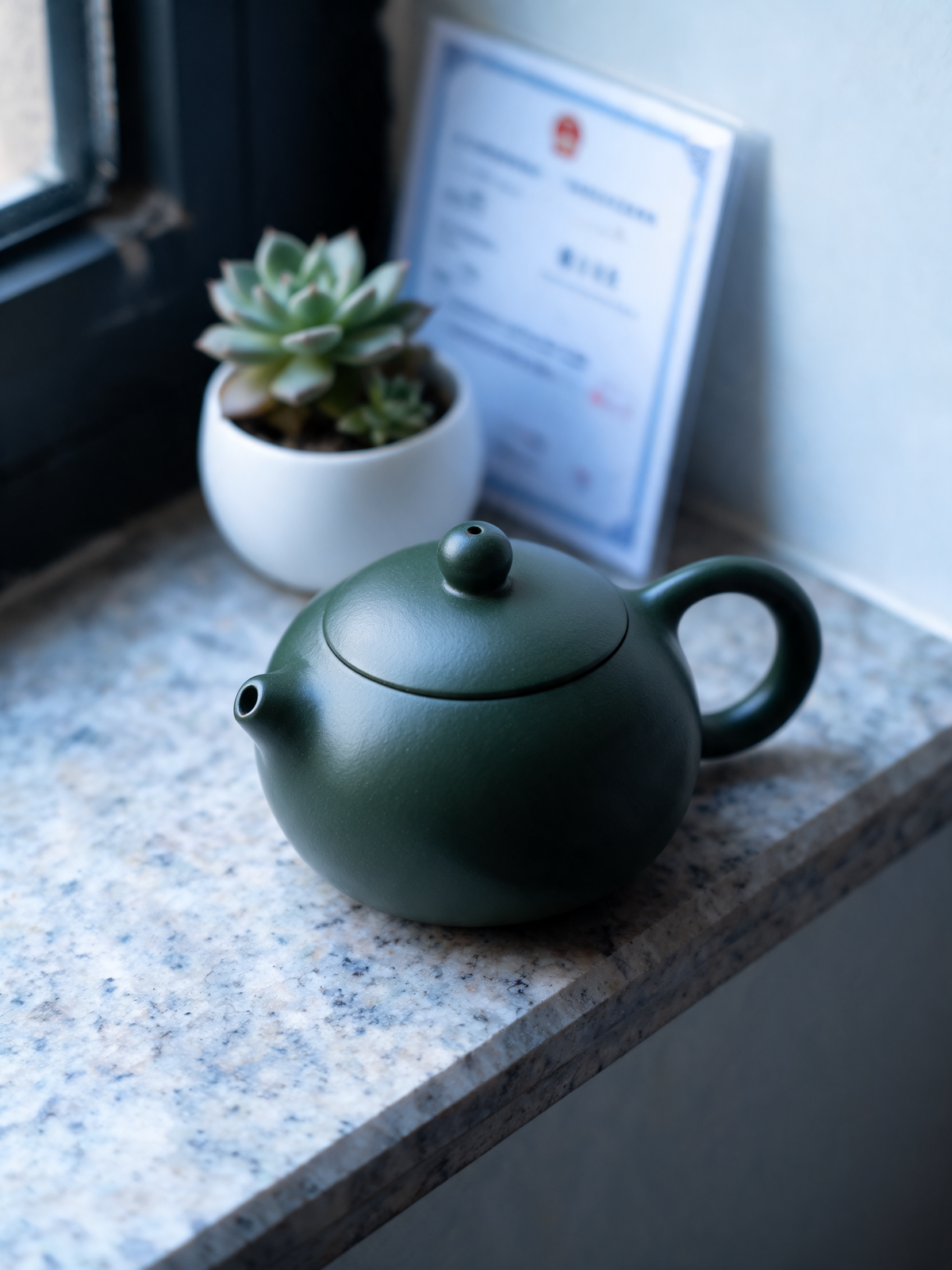 Detail of the green Luni clay surface on the Xishi teapot
